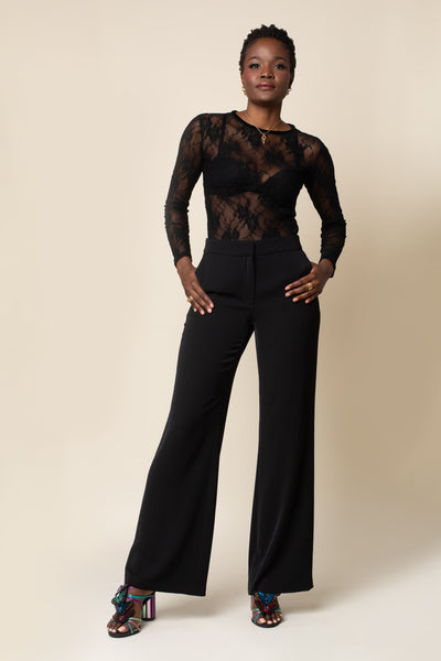 Front view of a fitted, long sleeves, sheer lace top in Black with black velvet trim on neck.