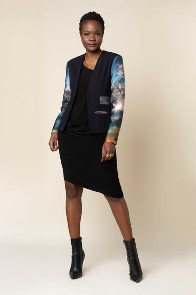 Front view of  accentuating and flattering Chaos Print Neoprene Tuxedo style jacket featuring printed Scuba back and sleeves with Stretch Gabardine front combo, hook & eye center front closure, and welt pocket to fit cell phone.