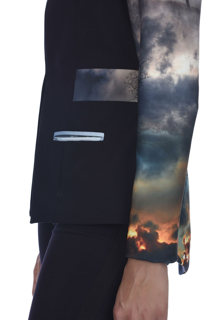 As we move towards a brighter future, we must consider what it once was. Our Chaos Print is a signature that narrates a story of sacrifice and triumph. Side view showcasing welt pockets and details of the print.